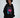 Model in an oversized black hoodie featuring a pink lips graphic, monogram print, and ruched sleeves.