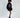 Model in black Lips Graphic oversized hoodie dress with ruched sleeves, streetwear aesthetic for Gen Z fashion.