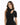 A woman with long, wavy hair wears a fitted black top featuring a mock neck and a stylish cutout.