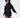 A model showcases a black hooded dress with an unique hemline, emphasizing and style.