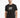 A man wearing a black t-shirt featuring a colorful geometric design on the front, standing against a white background.