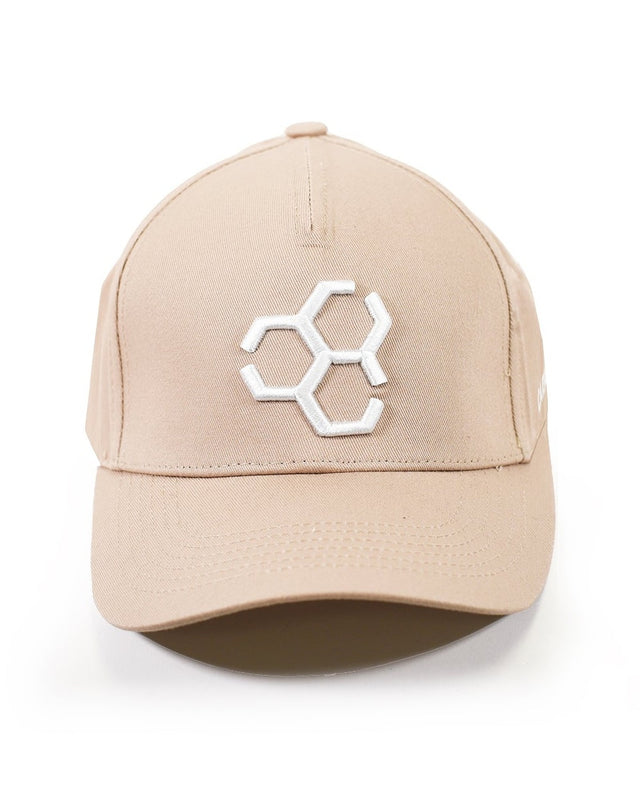 Tan Carbon streetwear baseball cap featuring a white embroidered Carbon logo centered on a white background.