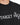 Black t-shirt featuring bold white text and star graphics, showcasing a modern, casual style.