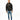Model wearing a Decent black oversized streetwear hoodie with orange drip graphic and blue skinny jeans.