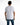 Back view of the Teddyator white graphic t-shirt in an oversized streetwear fit, paired with blue jeans.