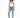 A model poses in a white tank top and distressed blue jeans, paired with white sneakers featuring pink accents.