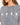 A close-up of a woman wearing a gray, oversized tee featuring hand signs spelling "LOVE" in white.