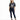 A woman stands confidently in a cropped graphic tee featuring a Florida design, paired with dark skinny jeans and bla...