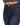 Close-up of dark blue denim jeans featuring a button closure and contrasting stitching details.