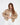 Model wearing the Thea beige puffer coat, a cropped outerwear style for women by Carbon.