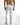 Back view of Luka white jeans with grey paint splatter, distressed details, and a back zipper pocket.