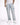Light blue distressed jeans with cargo pockets, styled with a white t-shirt and white sneakers.
