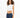 Model wearing the Luna white ribbed cropped tank top with padded shoulders and dark wash denim jeans.