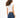 Back view of the Luna white ribbed cropped tank top and blue skinny jeans, highlighting the athletic body-hugging fit.