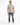 A man stands confidently in a short-sleeve striped shirt with beige, blue, and brown tones, paired with distressed je...