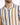 A close-up of a man wearing a short-sleeve shirt featuring vertical stripes in beige, brown, and blue.