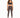 A woman stands confidently in fitted brown leggings paired with a dark sports bra and stylish sneakers.