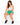 Woman seated on a white cube in green drawstring sweat shorts