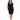 A woman in a fitted black dress with long sleeves and a decorative neckline stands confidently in front of a white ba...