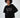 Model wearing Manhattan Top, a black oversized sweatshirt with white New York Central Park embroidery.