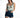 A model poses in a tie-dye tank top and high-waisted denim shorts, showcasing a casual summer look.