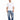 A man stands wearing a loose-fitting white t-shirt and light blue patchwork jeans, paired with white sneakers.