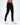 Marcus Marcus Dark Blue Men's Jeans by Carbon worn with white sneakers on a studio background.