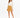 A woman stands confidently in a cream long-sleeve top paired with a mustard mini skirt and black strappy heels.