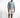 A man stands confidently in a light blue short-sleeve shirt and distressed white shorts, paired with casual sneakers.