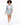 A model walks confidently in a light blue blazer paired with matching shorts and white sneakers.
