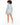 Light blue blazer worn with matching shorts, featuring a tailored fit and rolled sleeves, viewed from the back.