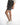 Side view of Maxine grey washed denim high-waisted shorts with horizontal seam detail and white sneakers.