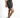 Side view of high-waisted Maxine grey washed denim shorts with visible stitching, paired with white sneakers.