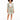 A model showcases a light green blazer and matching shorts, paired with a white crop top and white sneakers.
