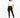A model wearing black leggings paired with a cropped white t-shirt and stylish black boots.