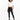 A model wearing black leggings paired with a cropped white t-shirt and stylish black boots.