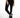 A close-up of a person wearing black leggings paired with stylish black and silver high-top sneakers.