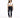 A woman stands confidently in a cropped white top and dark skinny jeans with distressed details, paired with white sn...