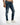 Fitted blue denim jeans with distressed details and a zippered pocket, paired with white sneakers.