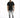 A man stands confidently in a black t-shirt, distressed gray jeans, and white sneakers against a plain background.