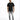 A man stands confidently in a black t-shirt, distressed gray jeans, and white sneakers against a plain background.