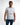 Man wearing white Mind Power Graphic Tee with streetwear prints and carbon yellow logo detail.