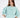 Model wearing a teal knit More and Less cropped sweatshirt with embossed text and puff sleeves against a white background.