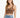 A woman with long hair wears a fitted brown ribbed crop top paired with high-waisted distressed denim shorts.