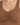 Close-up of a brown ribbed blouse featuring a v-neckline and gathered detailing at the center.