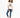 Woman in a More Love white graphic streetwear t-shirt, blue jeans, and white sneakers.