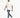 A man walks confidently in distressed blue jeans paired with a light beige oversized t-shirt and white sneakers.