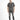 A man stands wearing a short-sleeve black and white checkered shirt paired with distressed gray jeans and black sneak...