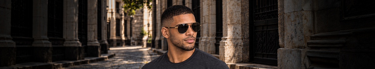 CARBON men's sunglasses campaign featuring Ric in gold aviator frames