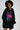 Model in an oversized black hoodie featuring a pink lips graphic, monogram print, and ruched sleeves.